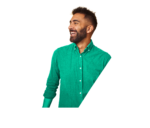 Man wearing a green shirt smiling and looking to the left